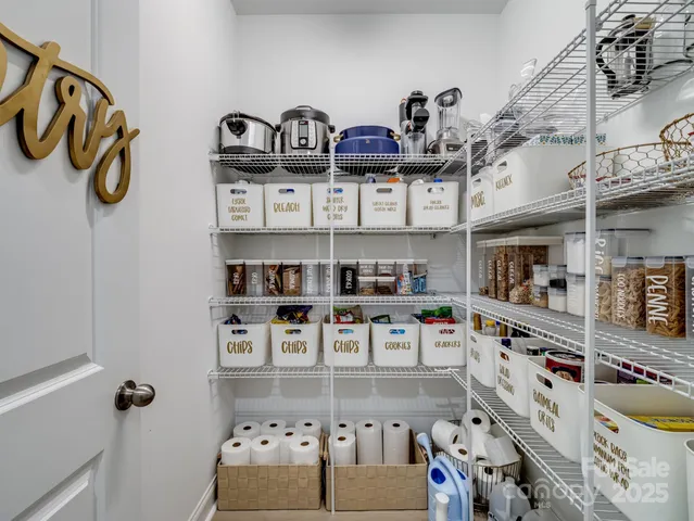 a kitchen with lots of clutter and cabinets