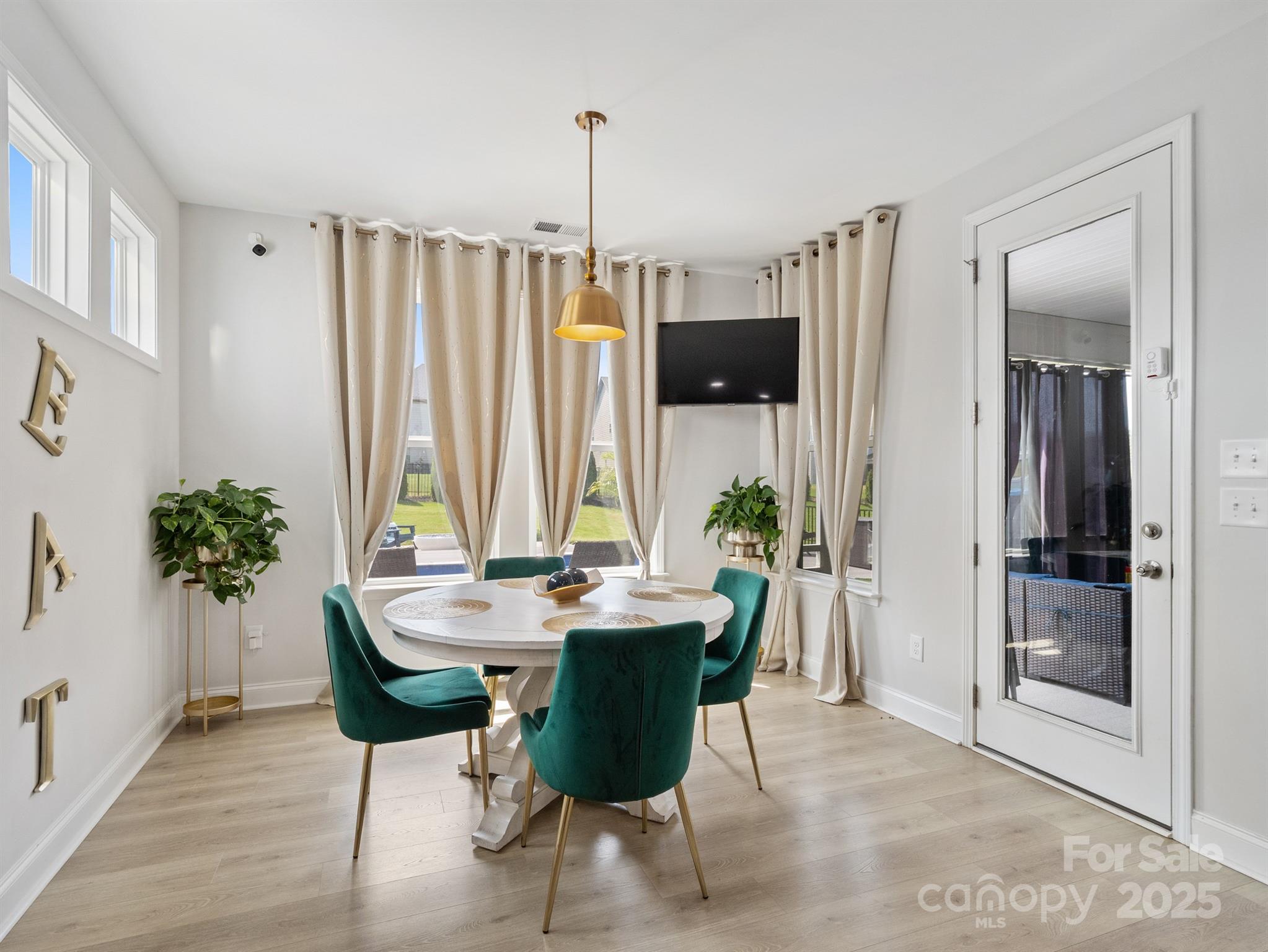 15213 Shallow Ridge Road Charlotte, NC 28278 - Photo 17 of 48 a view of a dining room with furniture window and wooden floor