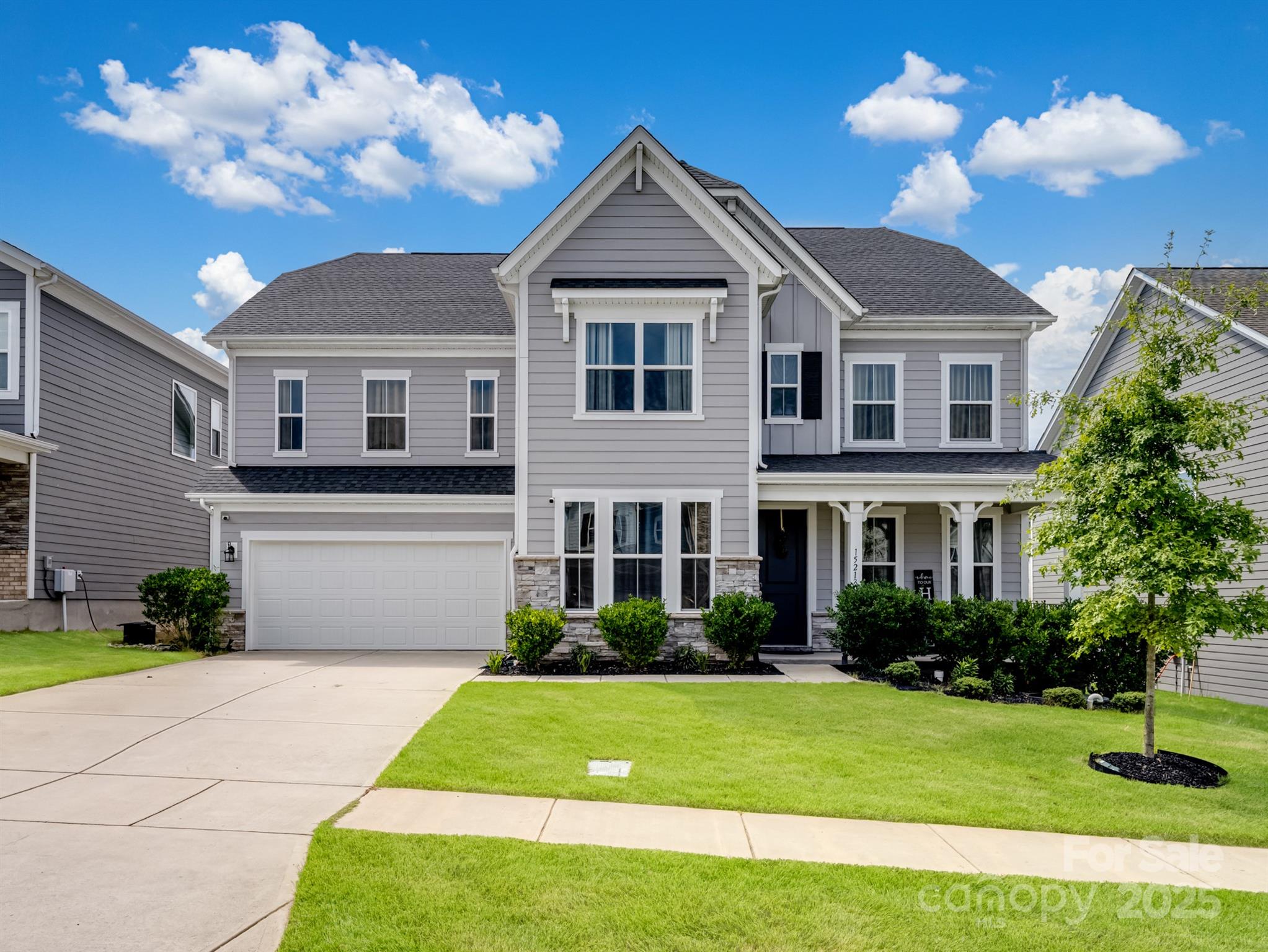 15213 Shallow Ridge Road Charlotte, NC 28278 - Photo 2 of 48 a front view of a house with garden