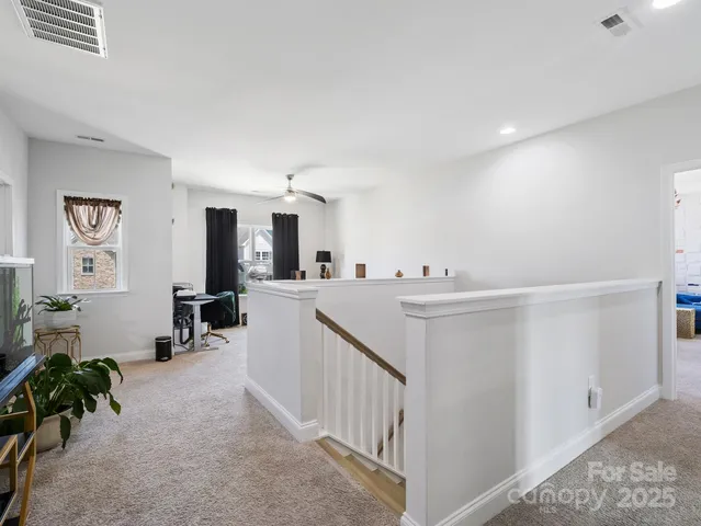 a view of kitchen with furniture and natural light
