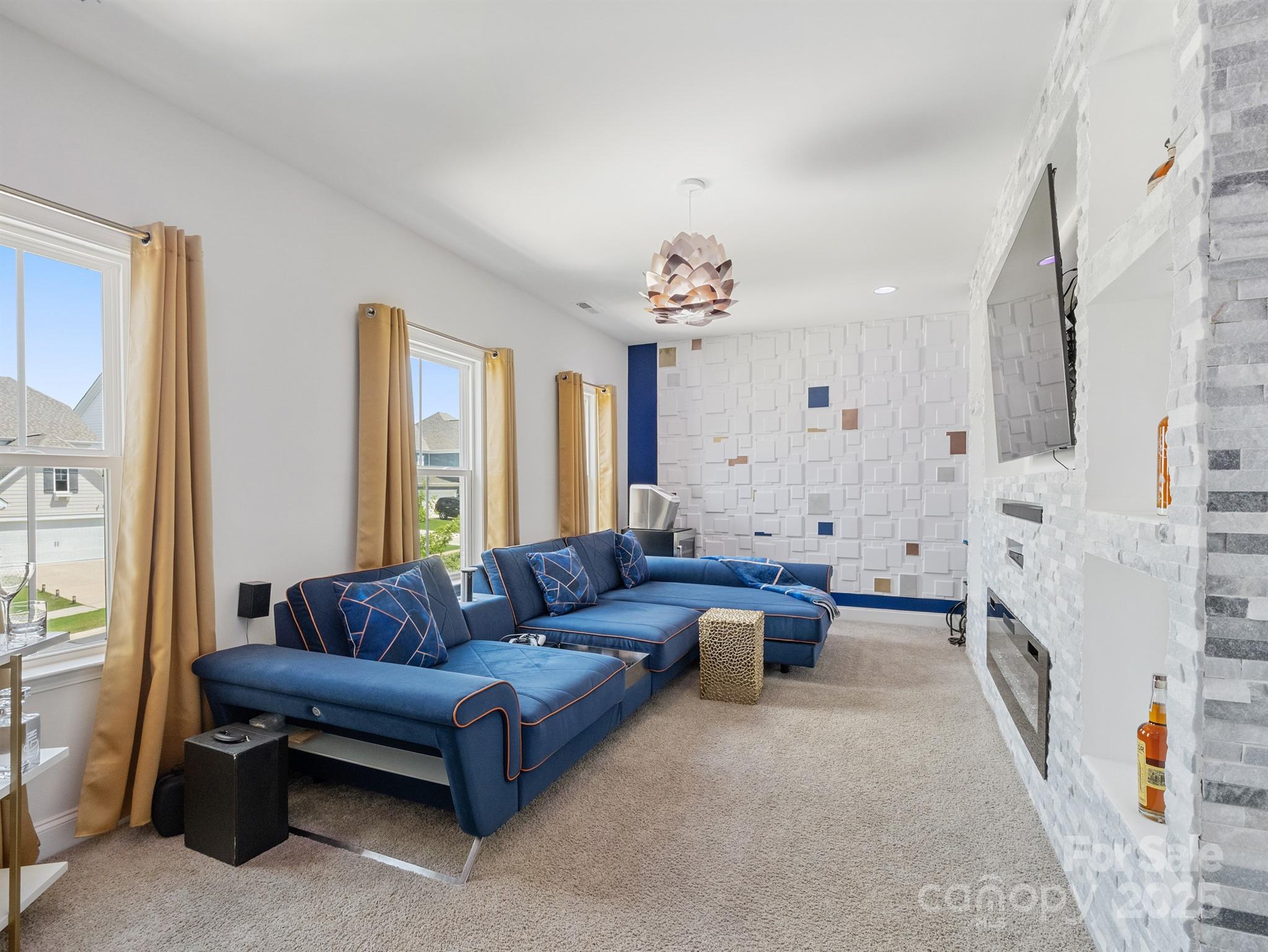 15213 Shallow Ridge Road Charlotte, NC 28278 - Photo 32 of 48 a living room with furniture and a fireplace