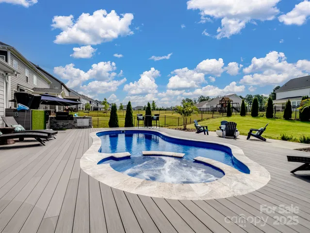 a view of a swimming pool with a patio