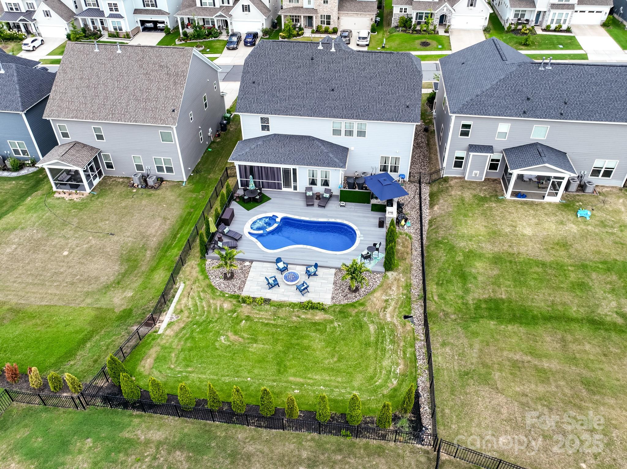 15213 Shallow Ridge Road Charlotte, NC 28278 - Photo 46 of 48 an aerial view of a house with garden space and street view