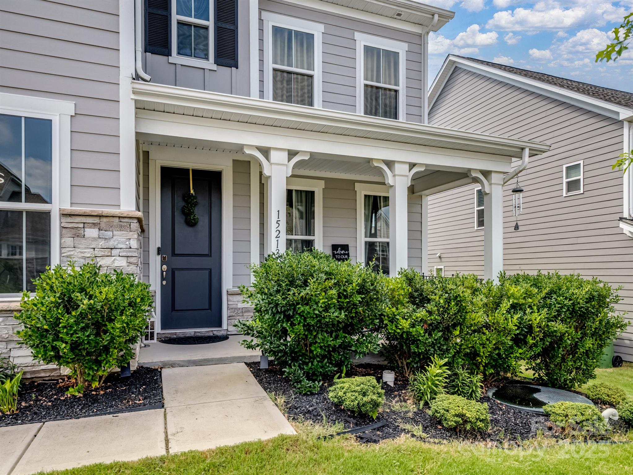 15213 Shallow Ridge Road Charlotte, NC 28278 - Photo 47 of 48 front view of a house with potted plants