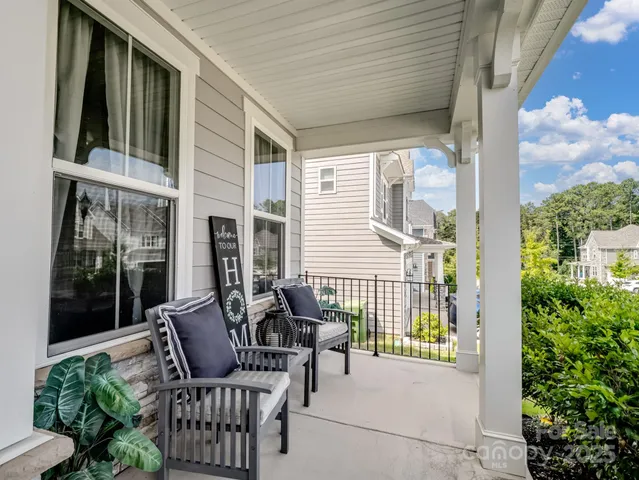 a view of a balcony with furniture