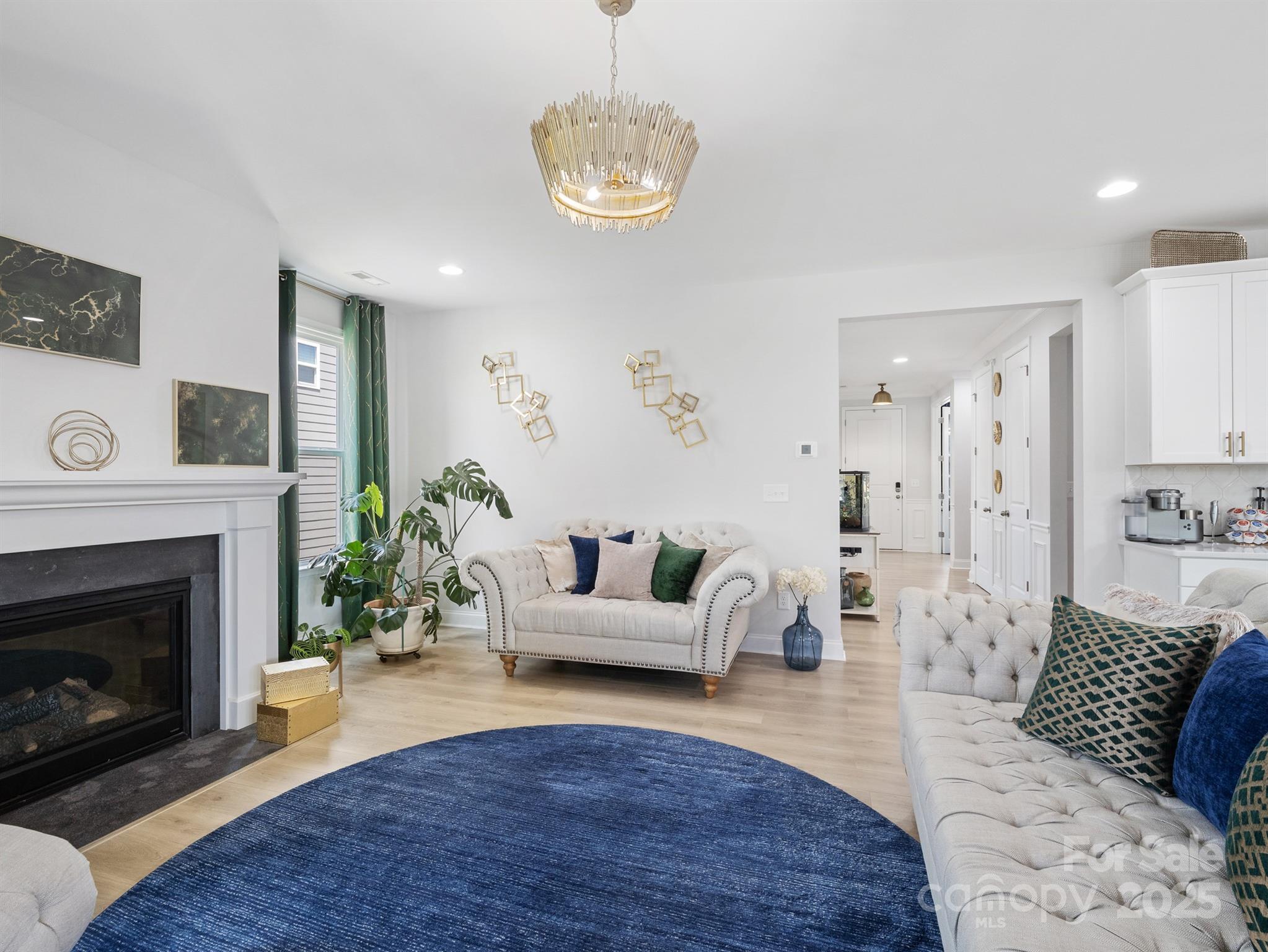15213 Shallow Ridge Road Charlotte, NC 28278 - Photo 9 of 48 a living room with furniture and a fireplace
