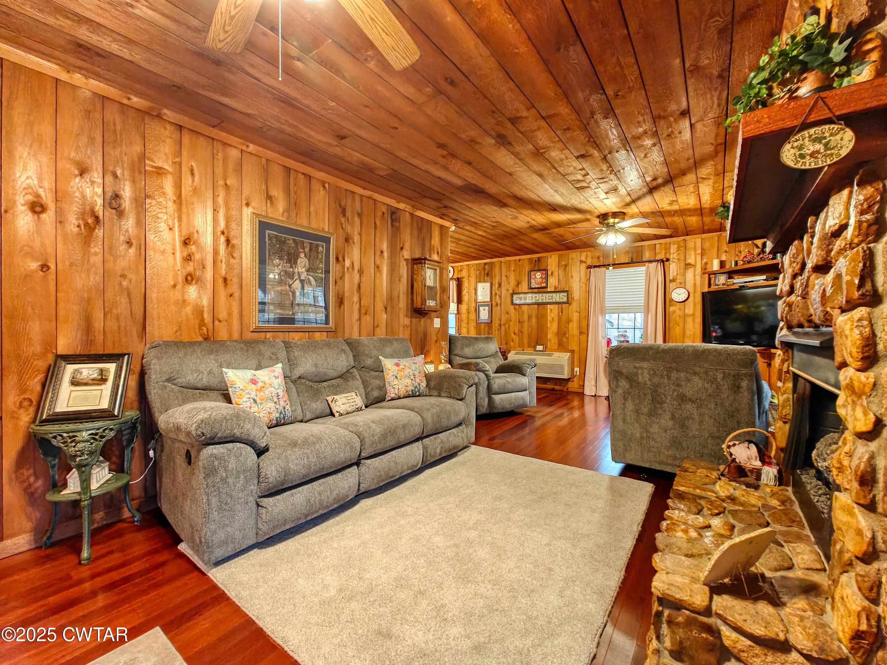 315 Coast Guard Road Buchanan, TN 38222 - Photo 14 of 41 a living room with furniture and a fireplace