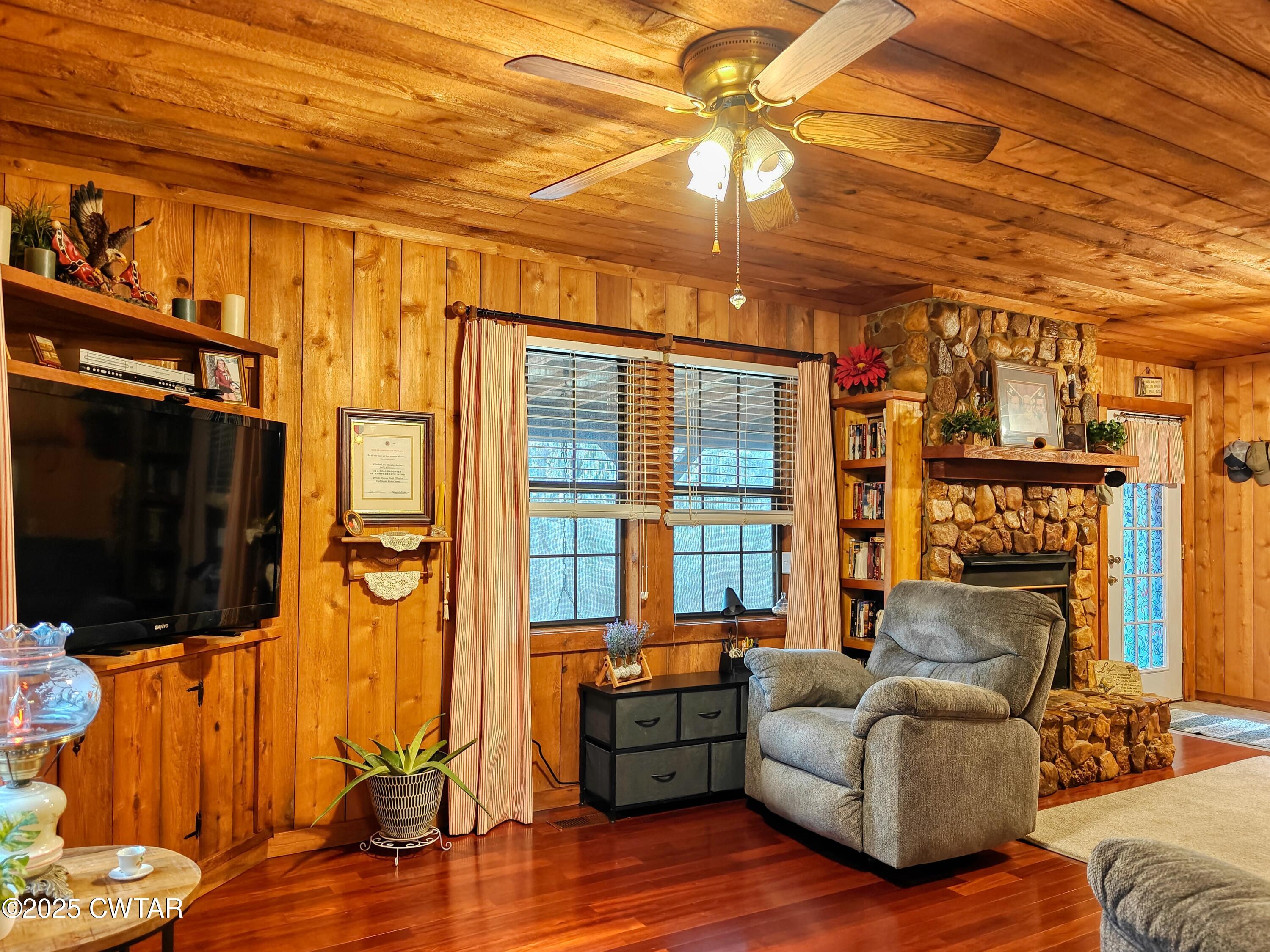 315 Coast Guard Road Buchanan, TN 38222 - Photo 17 of 41 a living room with furniture and a flat screen tv