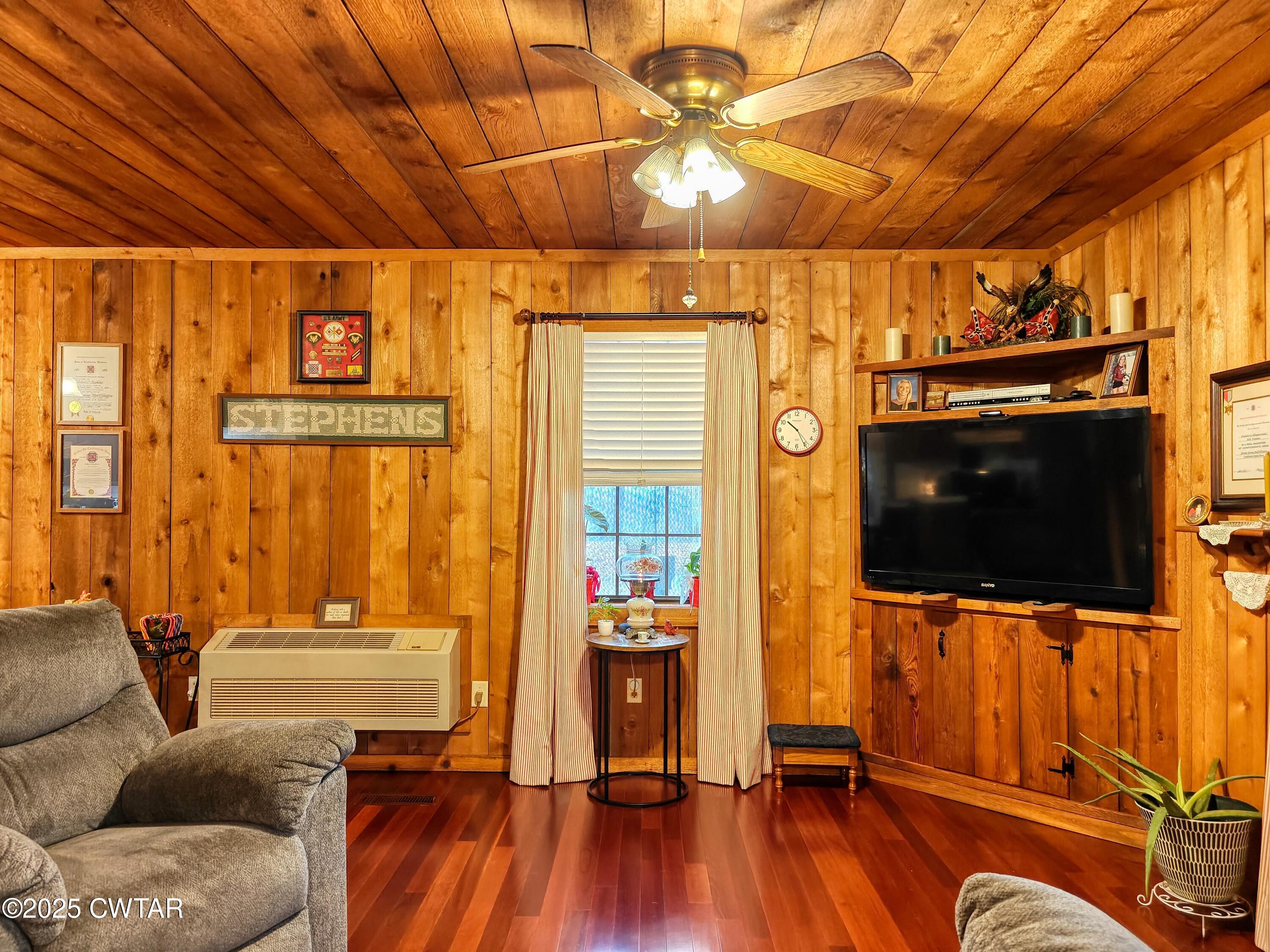 315 Coast Guard Road Buchanan, TN 38222 - Photo 18 of 41 a living room with furniture and a flat screen tv