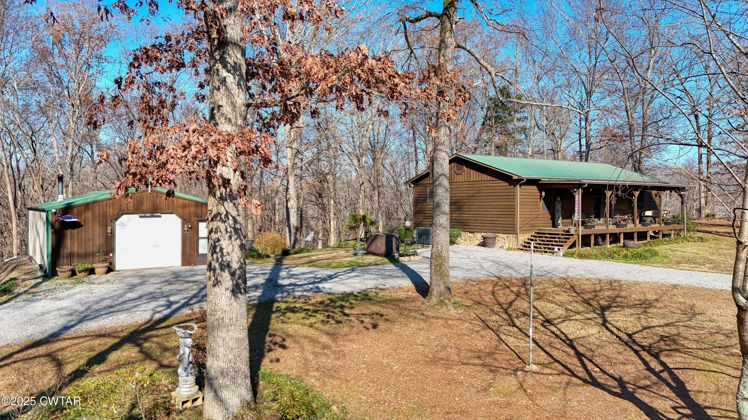 315 Coast Guard Road Buchanan, TN 38222 - Photo 2 of 41 a view of a house with backyard porch and sitting area