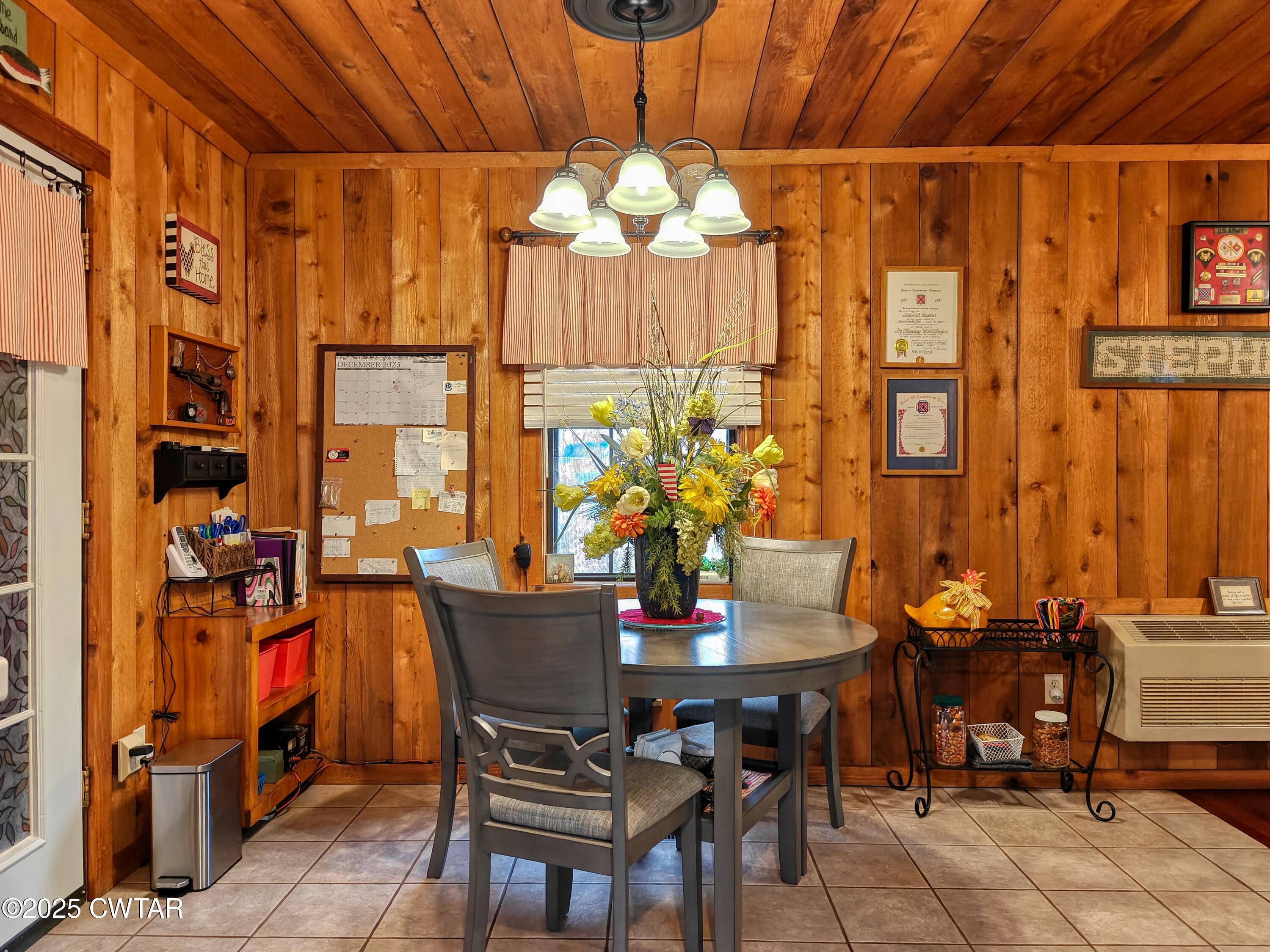 315 Coast Guard Road Buchanan, TN 38222 - Photo 22 of 41 a view of a dining room with furniture and chandelier