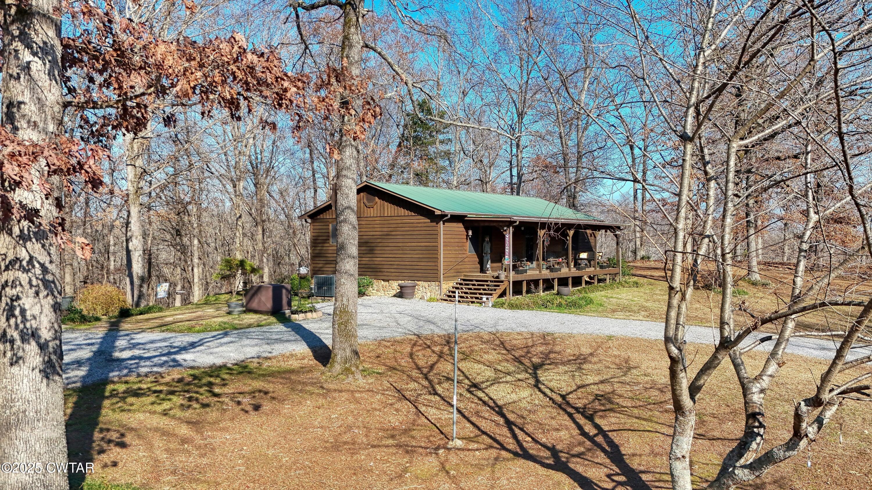 315 Coast Guard Road Buchanan, TN 38222 - Photo 3 of 41 a view of a house with backyard and sitting area