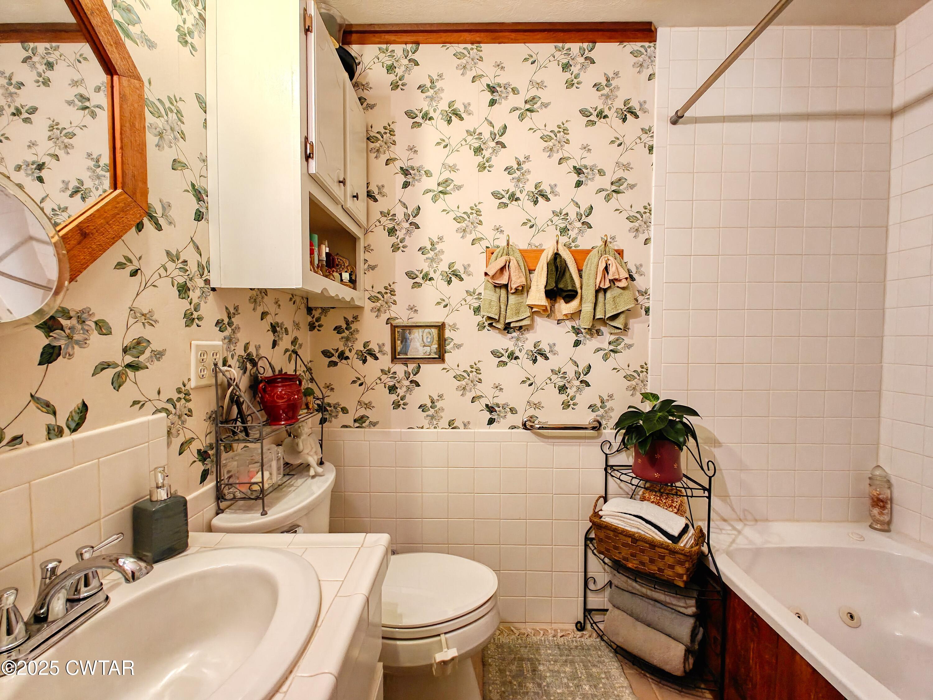 315 Coast Guard Road Buchanan, TN 38222 - Photo 31 of 41 a bathroom with a sink toilet and shower