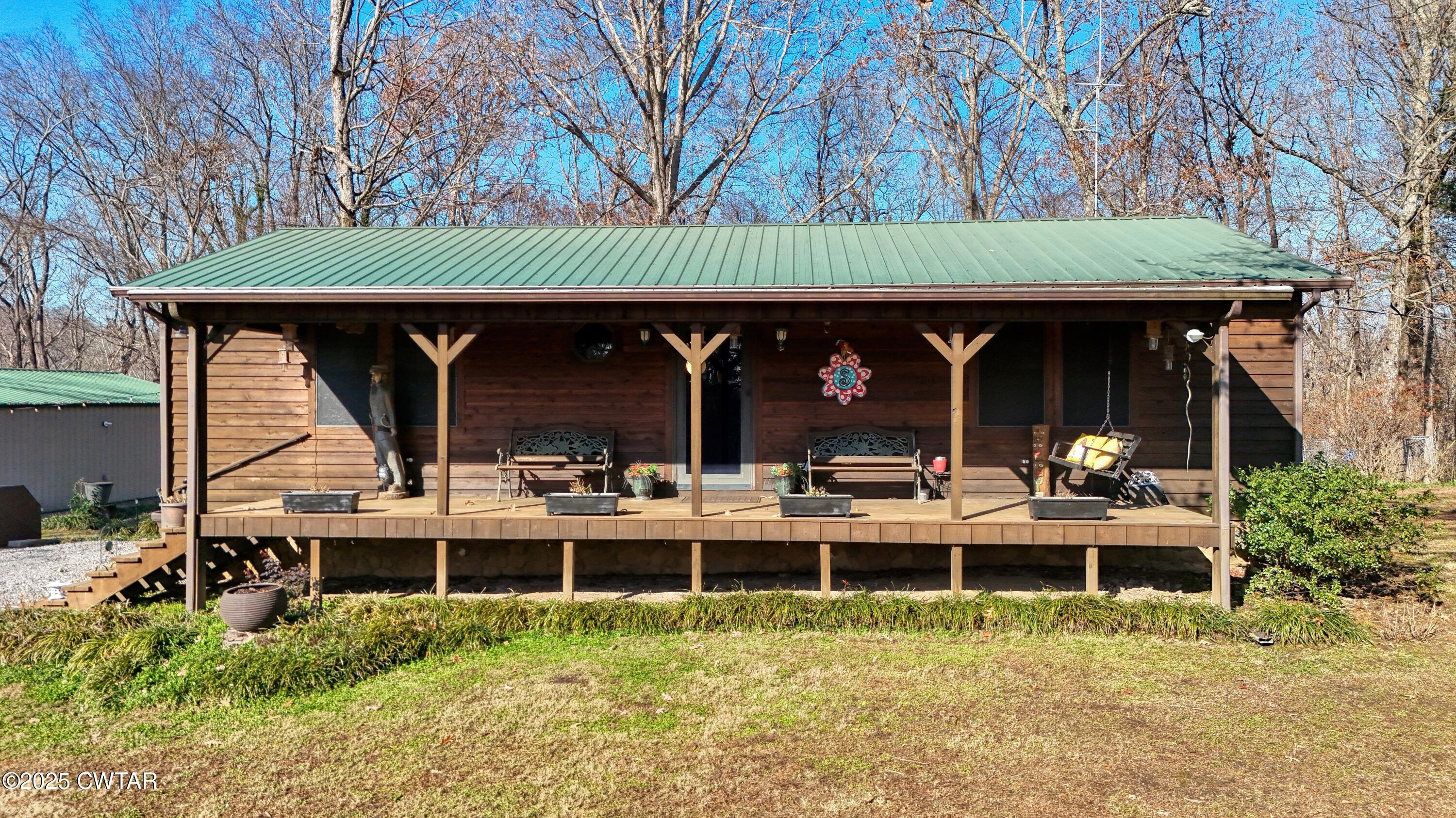 315 Coast Guard Road Buchanan, TN 38222 - Photo 5 of 41 a view of house with a swimming pool