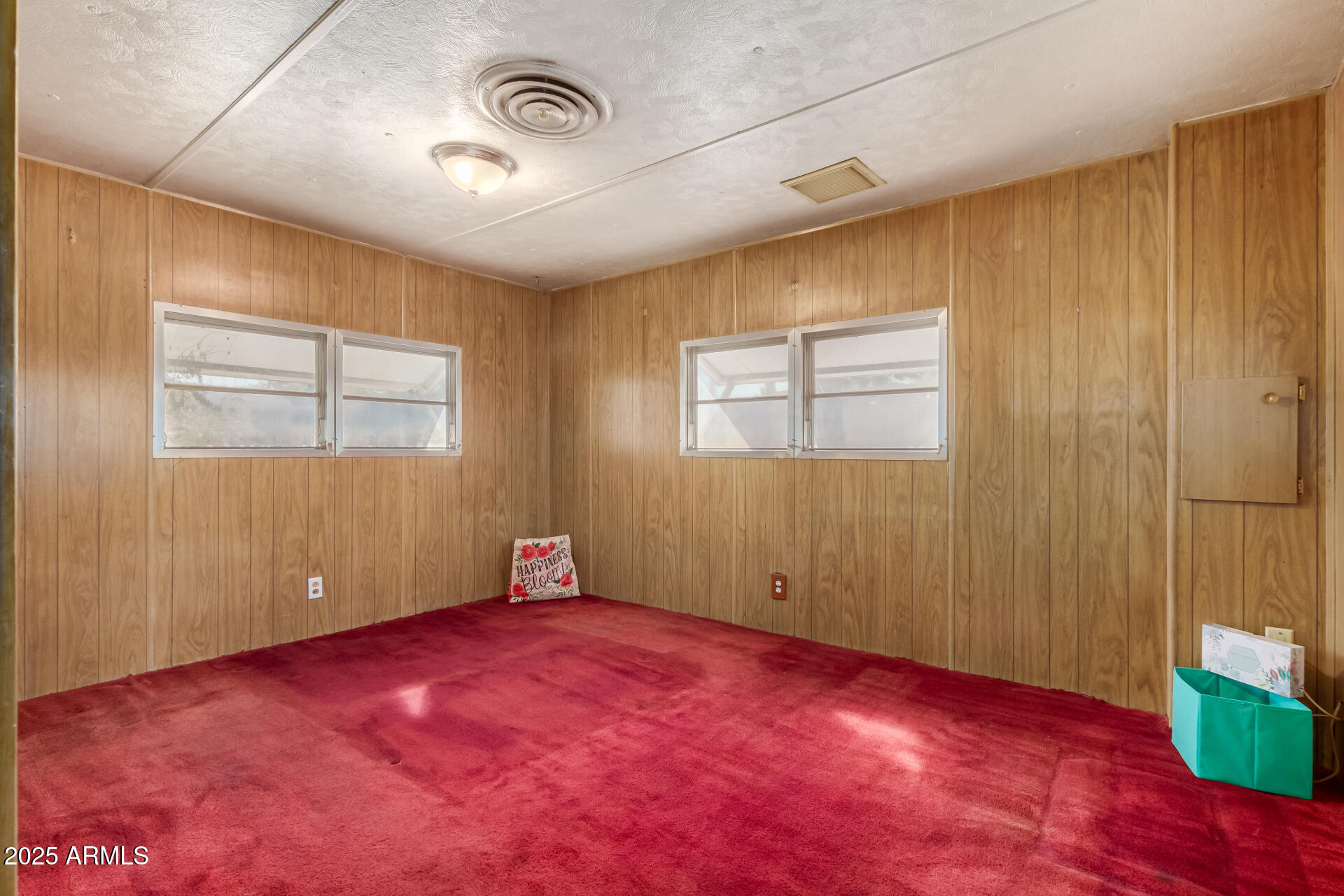 16225 North Cave Creek Road, Unit 1 Phoenix, AZ 85032 - Photo 11 of 33 an empty room with windows