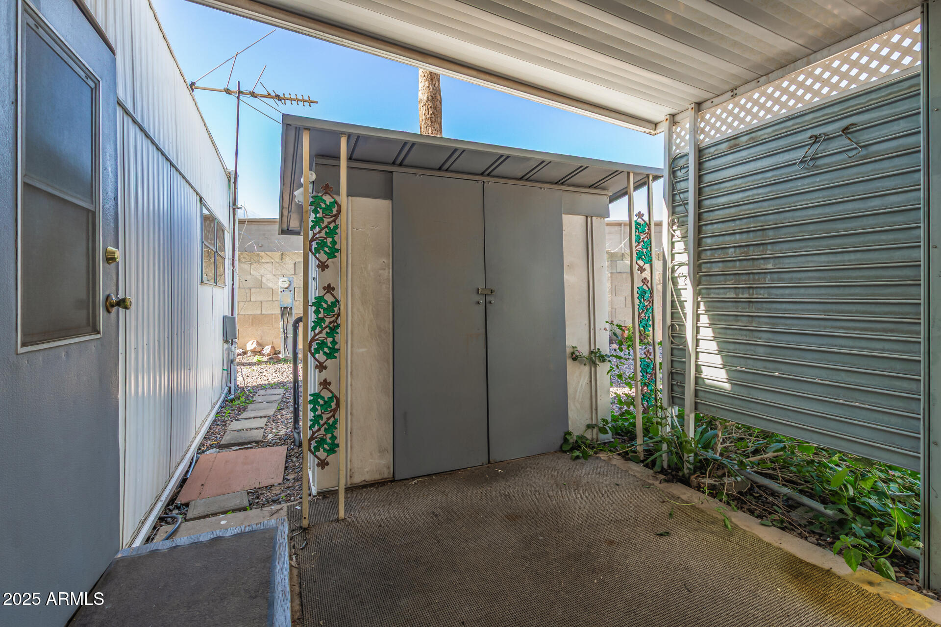 16225 North Cave Creek Road, Unit 1 Phoenix, AZ 85032 - Photo 16 of 33 a backyard of a house with potted plants