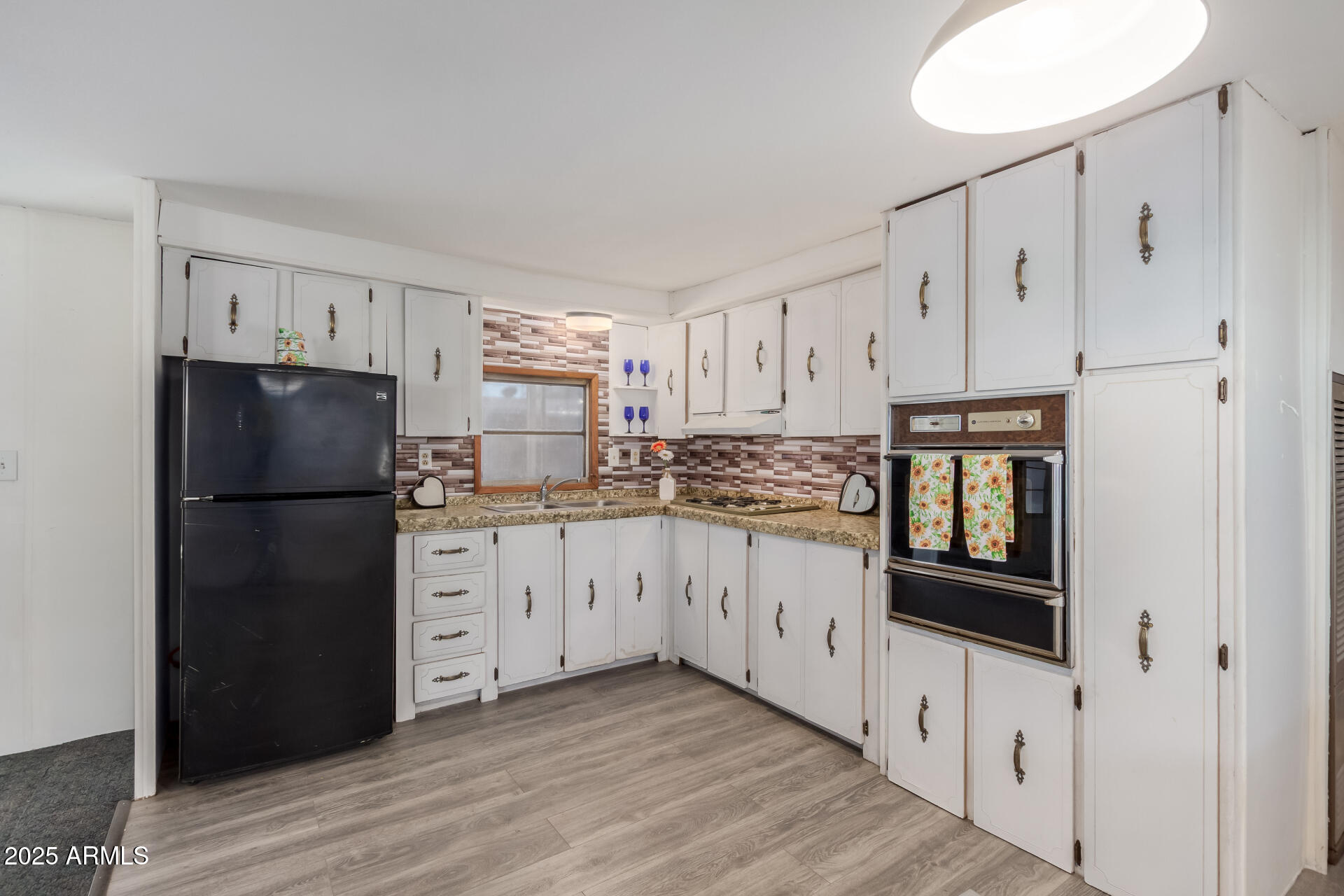 16225 North Cave Creek Road, Unit 1 Phoenix, AZ 85032 - Photo 2 of 33 a kitchen with granite countertop white cabinets and refrigerator