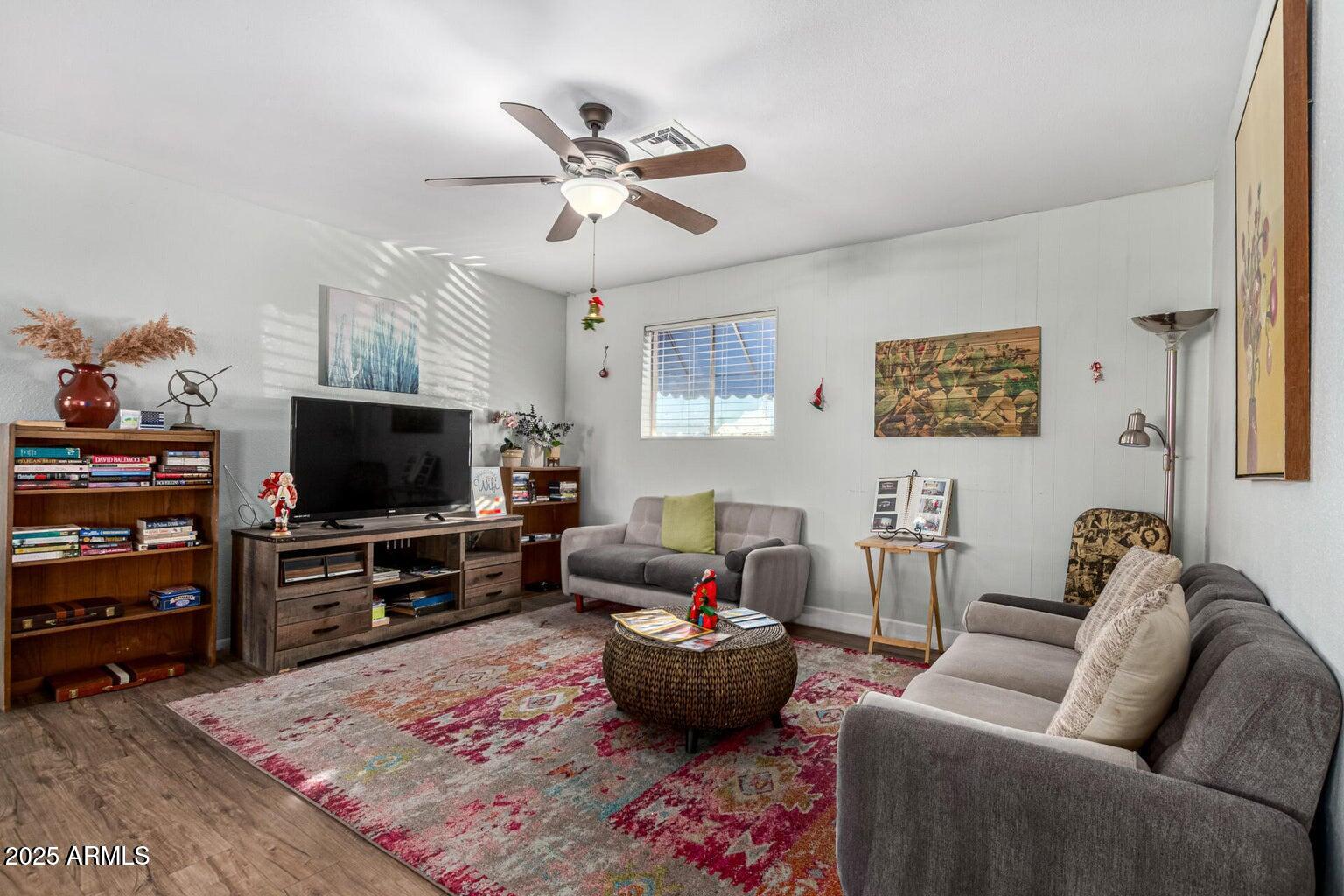 16225 North Cave Creek Road, Unit 1 Phoenix, AZ 85032 - Photo 26 of 33 a living room with furniture and a flat screen tv