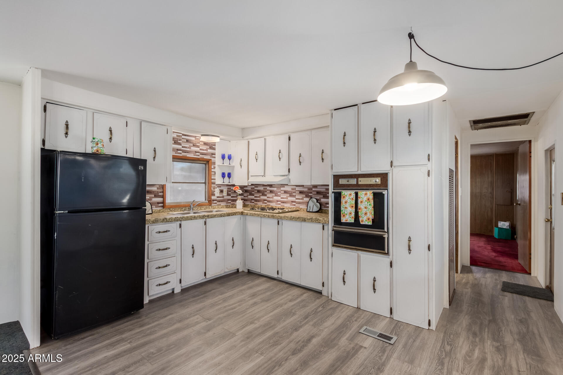 16225 North Cave Creek Road, Unit 1 Phoenix, AZ 85032 - Photo 29 of 33 a kitchen with stainless steel appliances a refrigerator and a stove