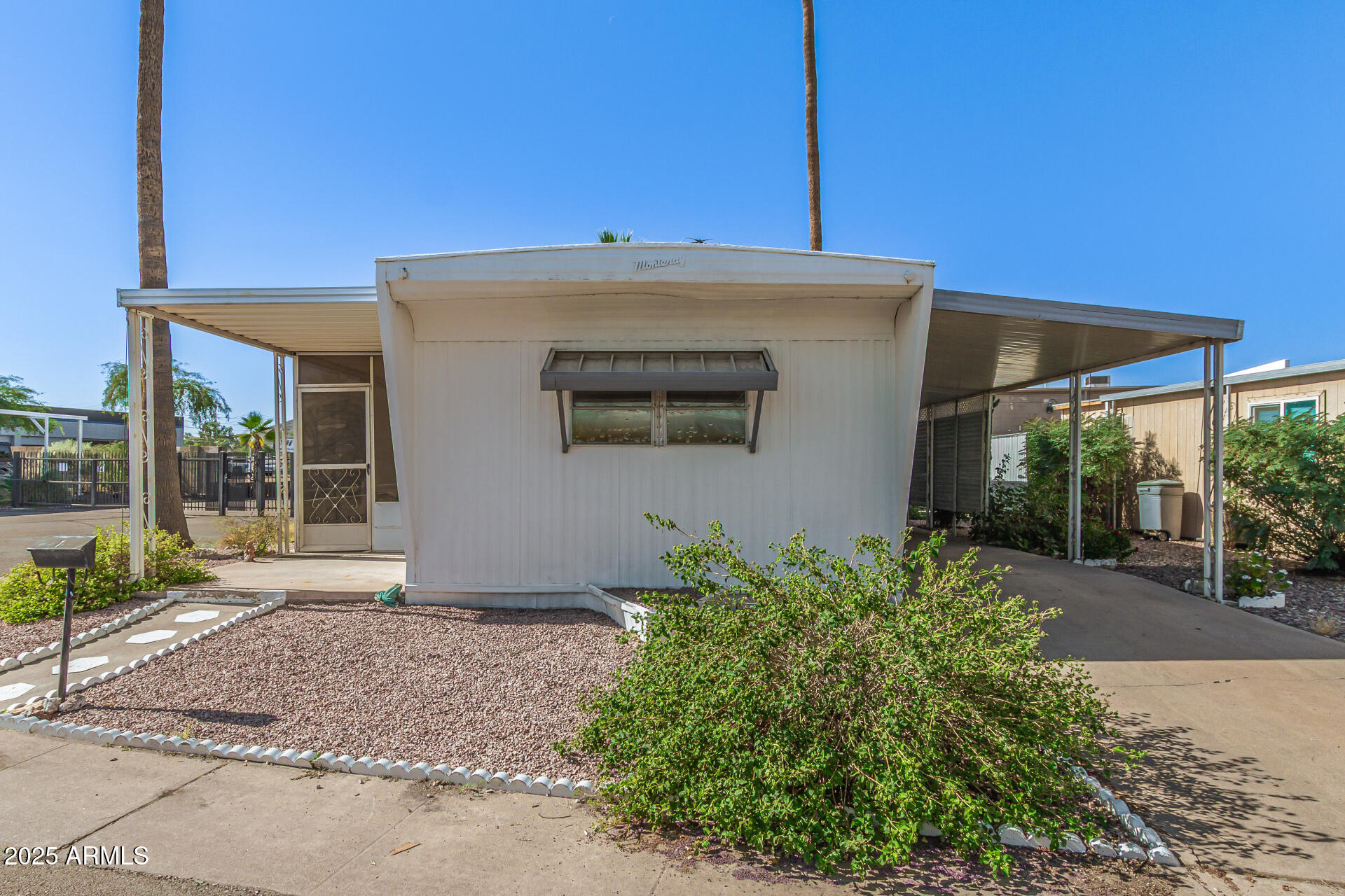 16225 North Cave Creek Road, Unit 1 Phoenix, AZ 85032 - Photo 30 of 33 a front view of a house with garden