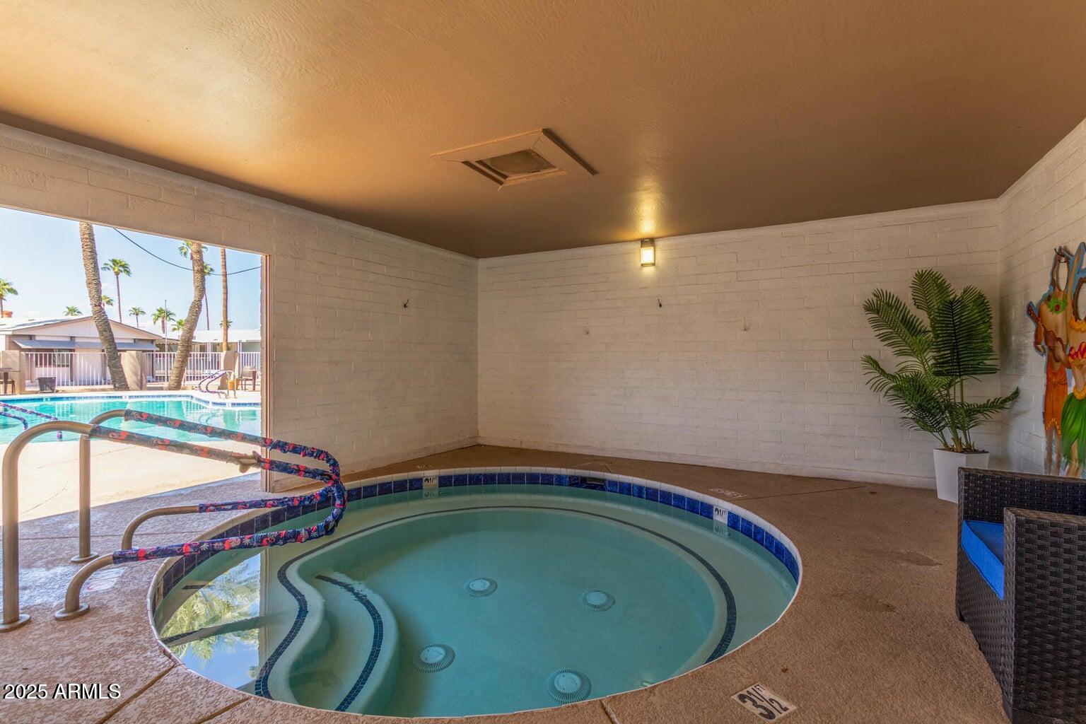 16225 North Cave Creek Road, Unit 1 Phoenix, AZ 85032 - Photo 32 of 33 a house with a swimming pool