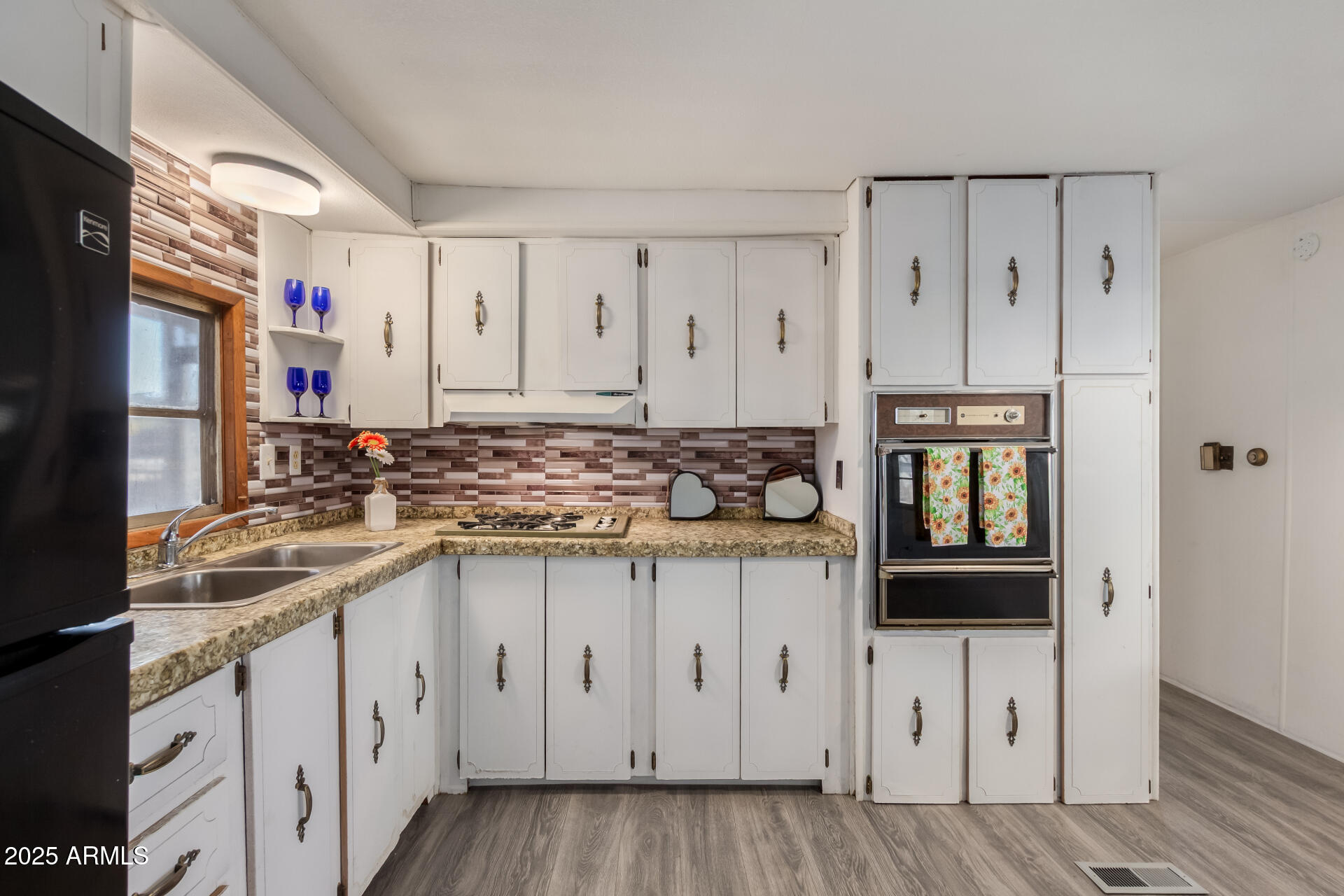 16225 North Cave Creek Road, Unit 1 Phoenix, AZ 85032 - Photo 4 of 33 a kitchen with stainless steel appliances granite countertop a sink and cabinets