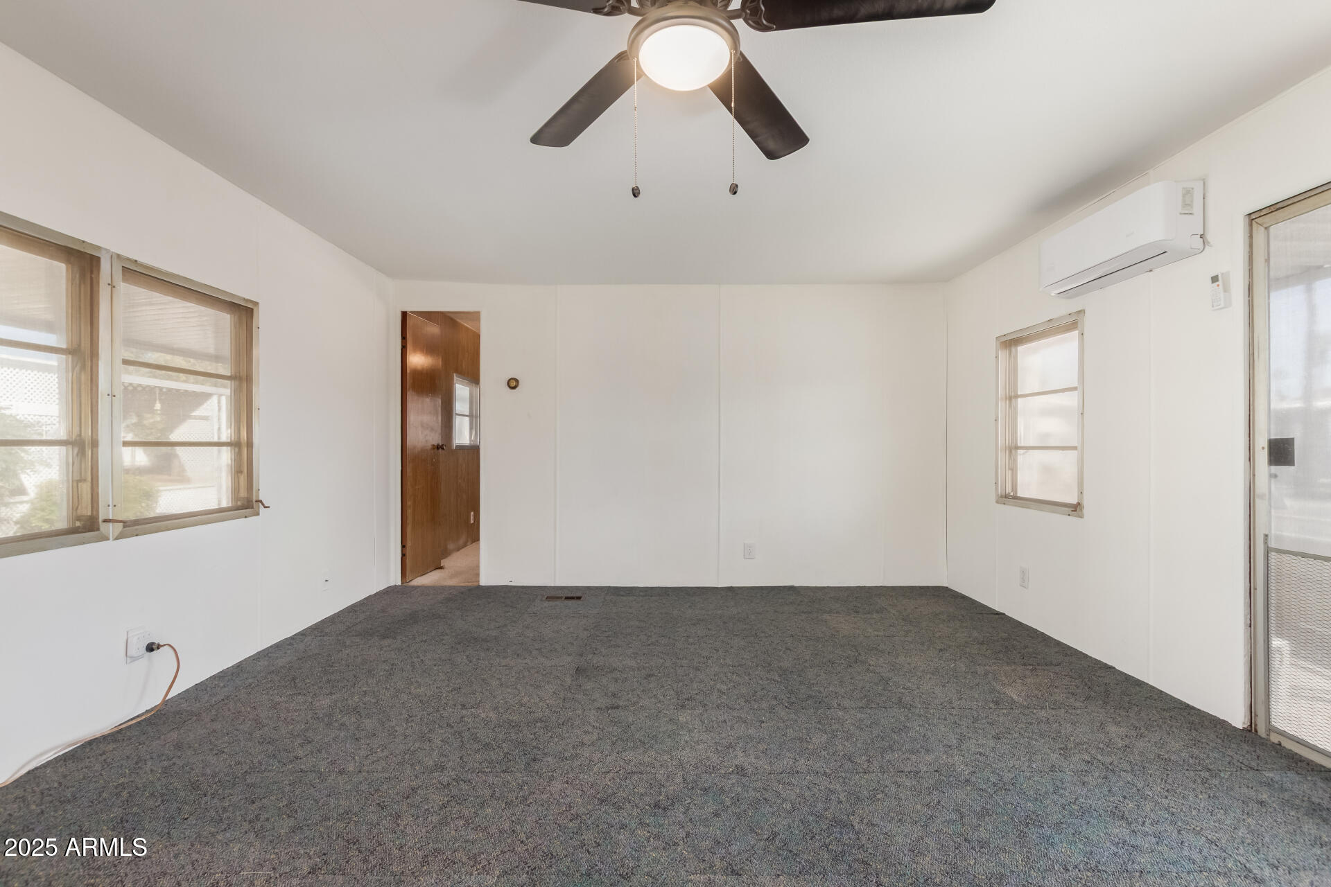 16225 North Cave Creek Road, Unit 1 Phoenix, AZ 85032 - Photo 5 of 33 a view of an empty room with a window