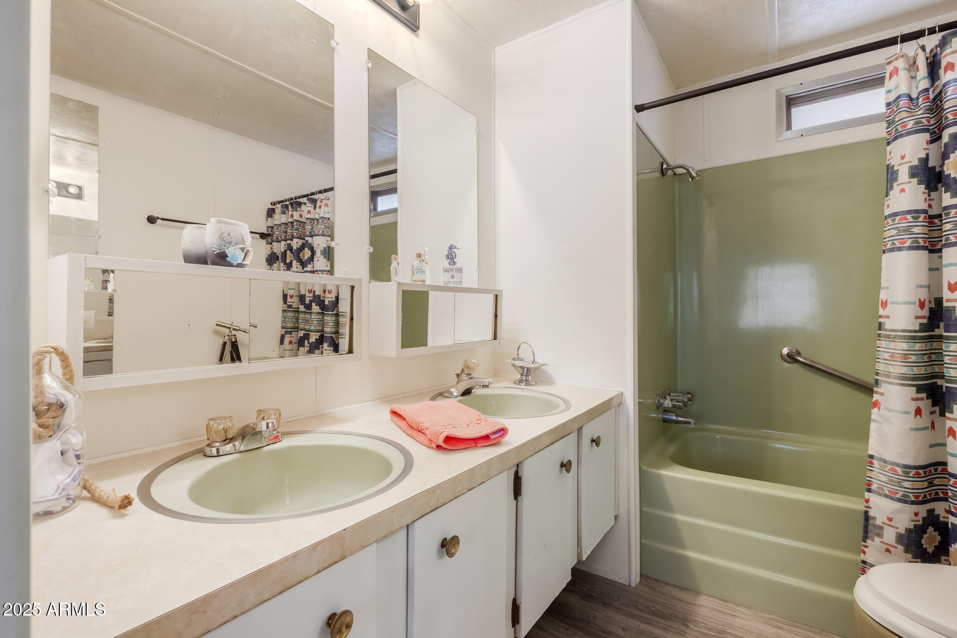 16225 North Cave Creek Road, Unit 1 Phoenix, AZ 85032 - Photo 10 of 33 a bathroom with a sink and a mirror