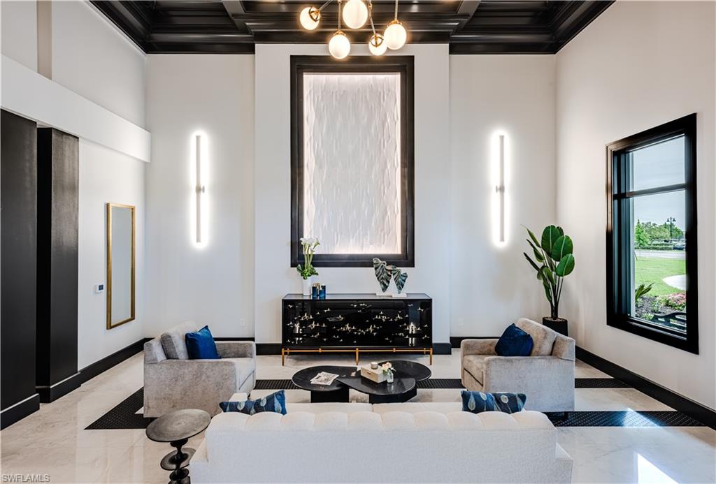 5583 Double Eagle Circle, Unit 4134 Immokalee, FL 34142 - Photo 29 of 32 a living room with furniture flowerpot and wooden floor