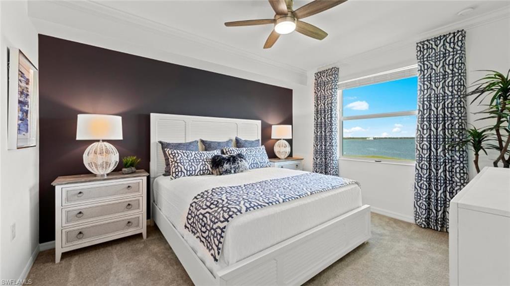 5583 Double Eagle Circle, Unit 4134 Immokalee, FL 34142 - Photo 9 of 32 a bedroom with a bed and a mirror on the dresser