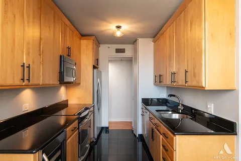 a kitchen with stainless steel appliances a stove and a refrigerator