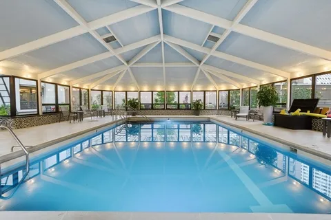 a view of a swimming pool with a chair