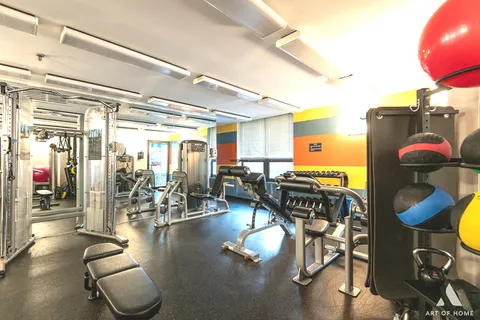 a view of a patio with table and chairs barbeque potted plants and large tree