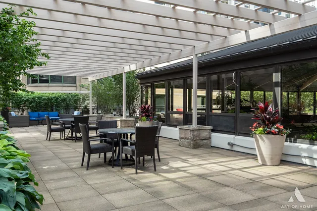 a view of a patio with couches and a table and chairs