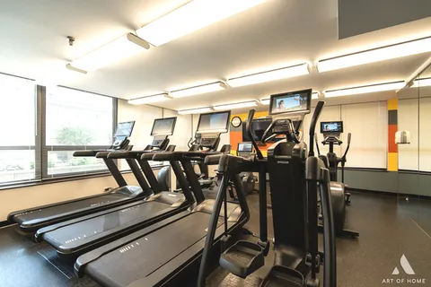 a kitchen with stainless steel appliances a stove a sink and a refrigerator