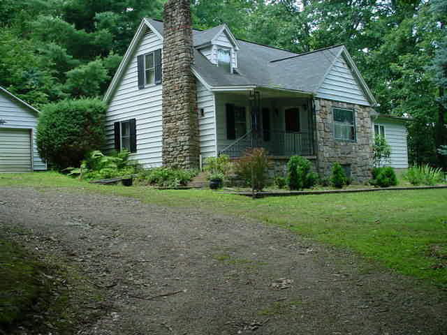 206 Smokey Hill Road Tionesta, PA 16353 - Photo 1 of 1 a view of a house with yard and a garden