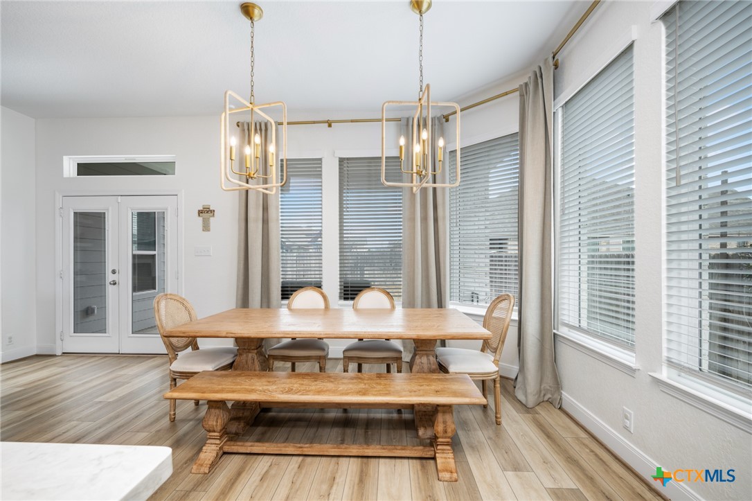 2939 Rems New Braunfels, TX 78130 - Photo 20 of 41 a view of a dining room with furniture wooden floor and chandelier