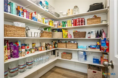 a view of a bathroom with a sink and a mirror