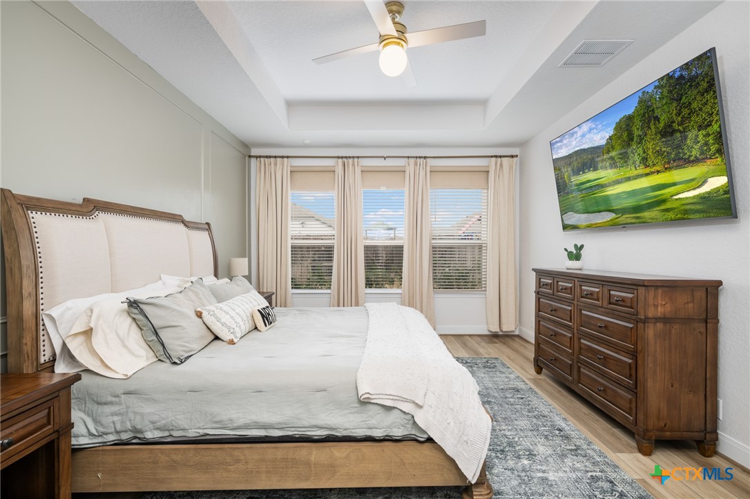 2939 Rems New Braunfels, TX 78130 - Photo 24 of 41 a bedroom with a bed and a flat screen tv