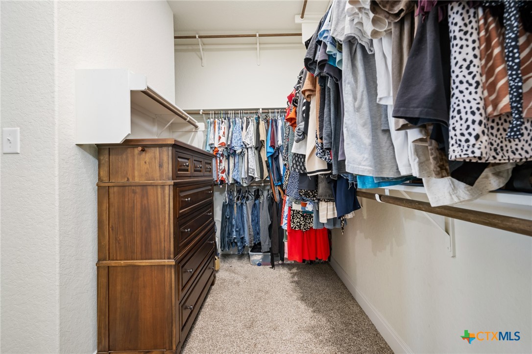 2939 Rems New Braunfels, TX 78130 - Photo 30 of 41 a view of walk in closet with clothes and shoes