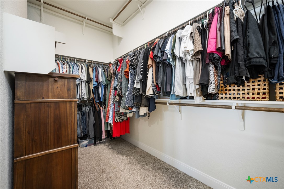 2939 Rems New Braunfels, TX 78130 - Photo 31 of 41 a view of walk in closet with clothes