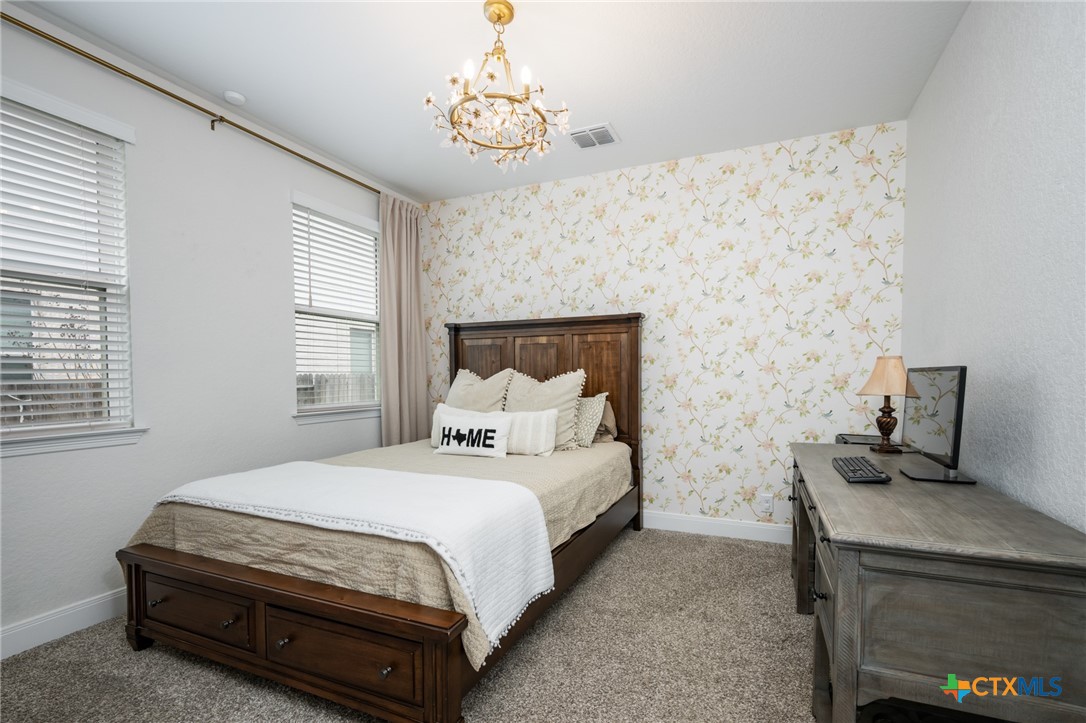 2939 Rems New Braunfels, TX 78130 - Photo 34 of 41 a bedroom with a bed and a table