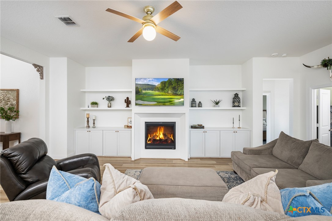 2939 Rems New Braunfels, TX 78130 - Photo 8 of 41 a living room with furniture and a fireplace