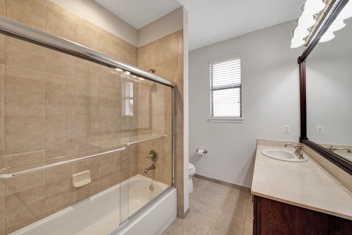 9170 Equus Circle Boynton Beach, FL 33472 - Photo 35 of 71 a bathroom with a tub a sink and a mirror
