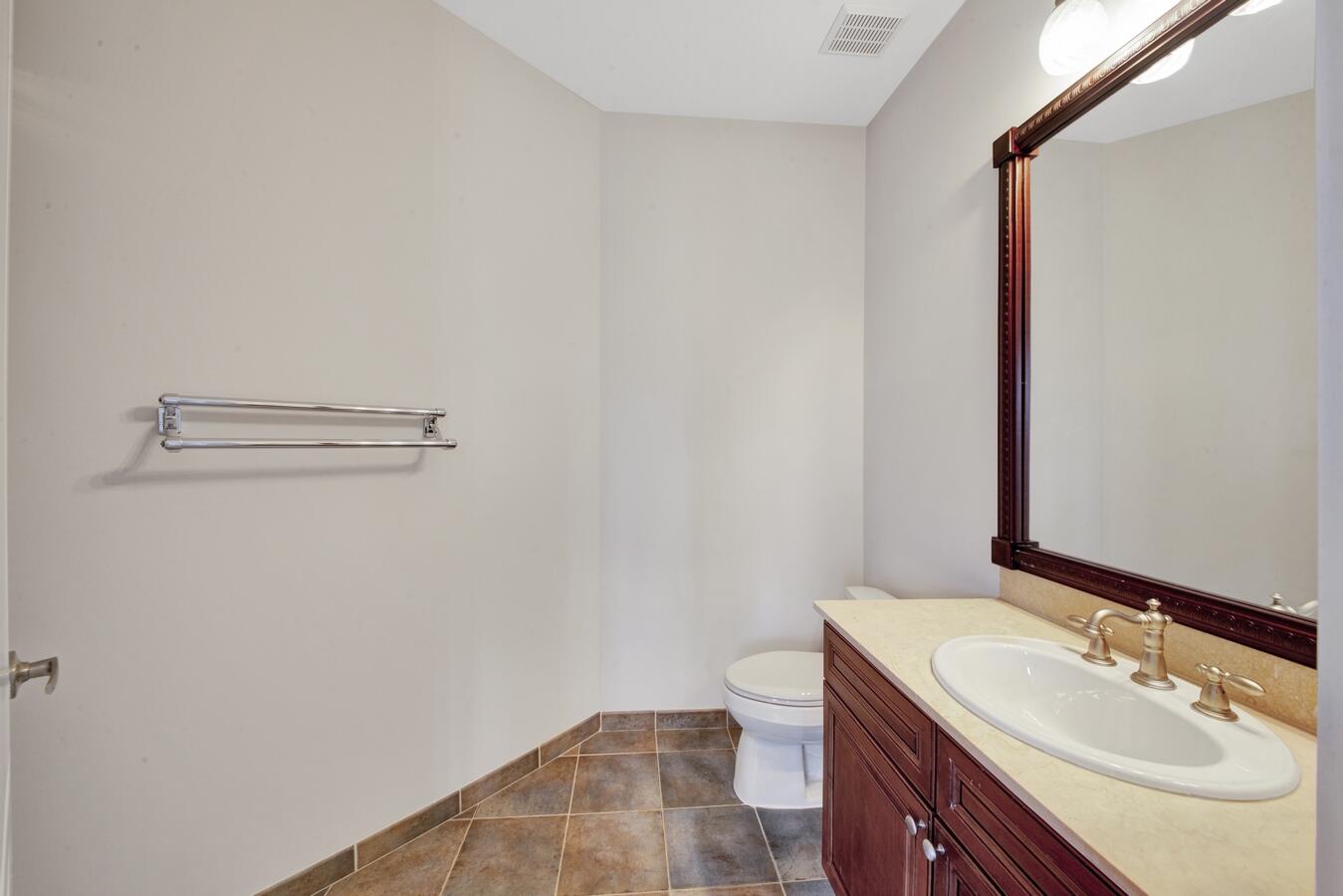 9170 Equus Circle Boynton Beach, FL 33472 - Photo 38 of 71 a bathroom with a sink toilet and vanity