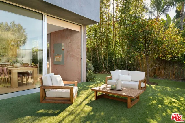 a large kitchen with a table and chairs in it