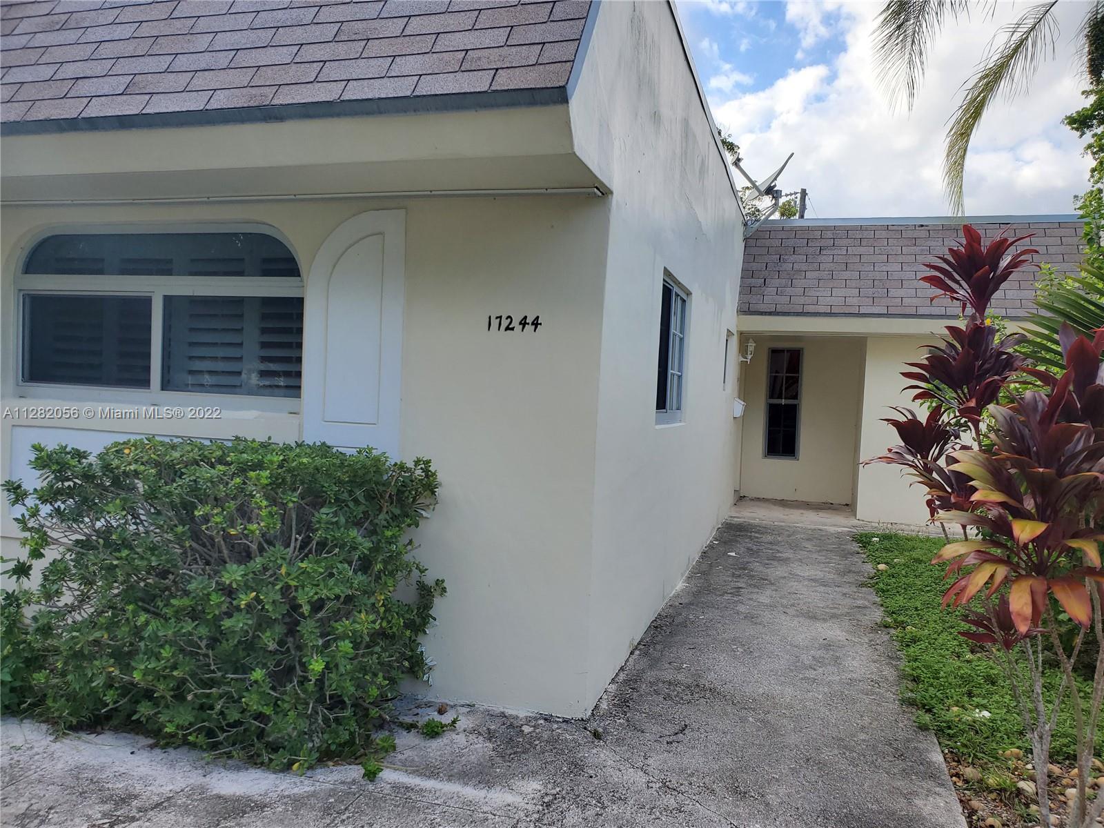 West Perrine Miami, FL 33157 - Photo 1 of 24 a front view of a house with a yard