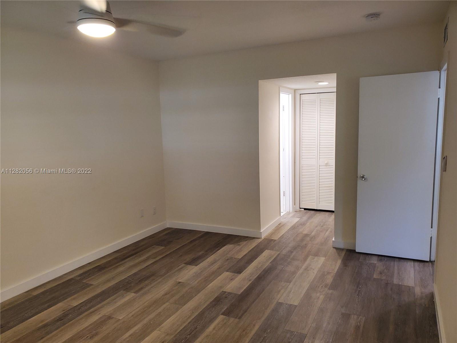 West Perrine Miami, FL 33157 - Photo 12 of 24 a view of an empty room with wooden floor