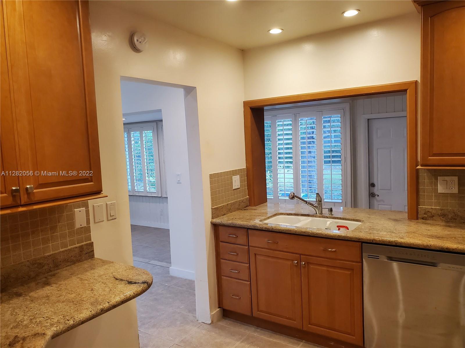 West Perrine Miami, FL 33157 - Photo 6 of 24 a bathroom with a granite countertop sink and a mirror