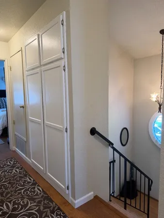 a view of an entryway with wooden floor